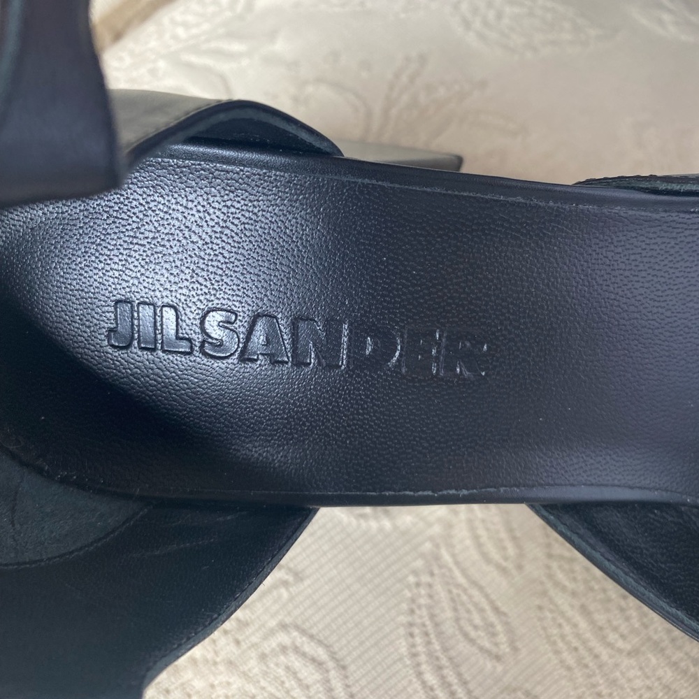 Jil Sander black platforms with ankle strap.